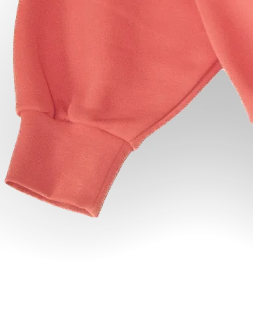 Nahaufnahme eines Ärmelbündchens von Work 01 in Bubblegum Pink (Rosa): Der weite Ärmel läuft in ein tiefes Rippenbündchen.